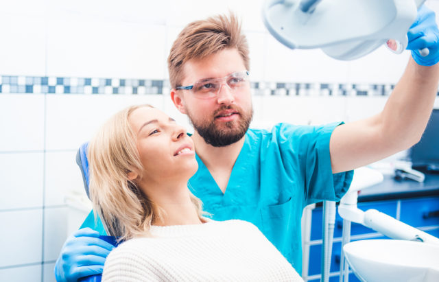 Patient and dentist in the dental office