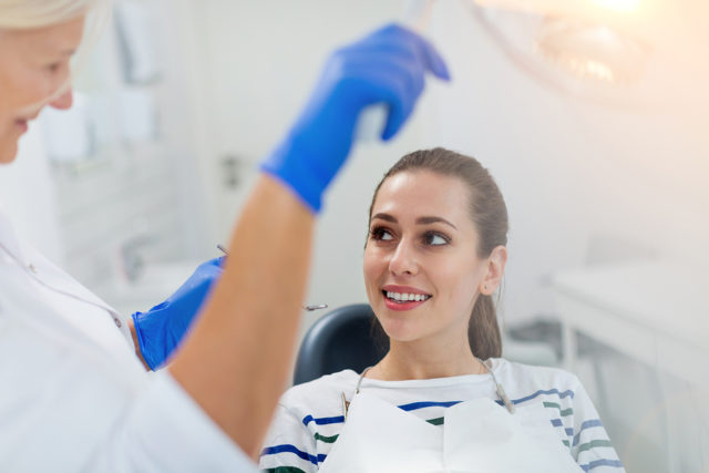 Female dentist and patient in dentist office