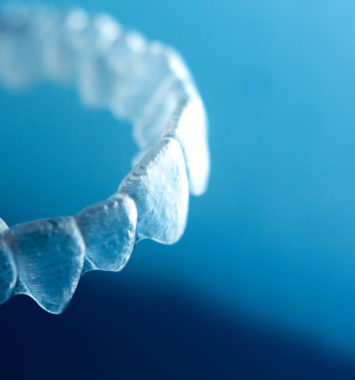 Invisible dental bracket aligners for modern orthodontic treatment to straighten teeth and improve dental hygiene.