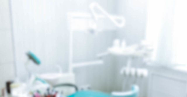 Blurred image of the dentist office, medical background. Dentist cabinet.