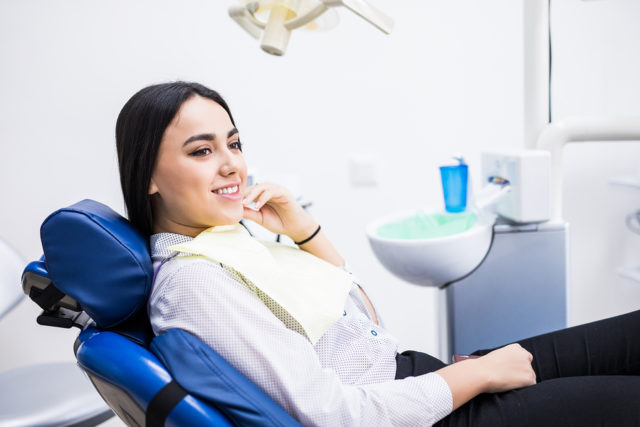 Overview Of Dental Caries Prevention. Woman At The Dentist’s Cha